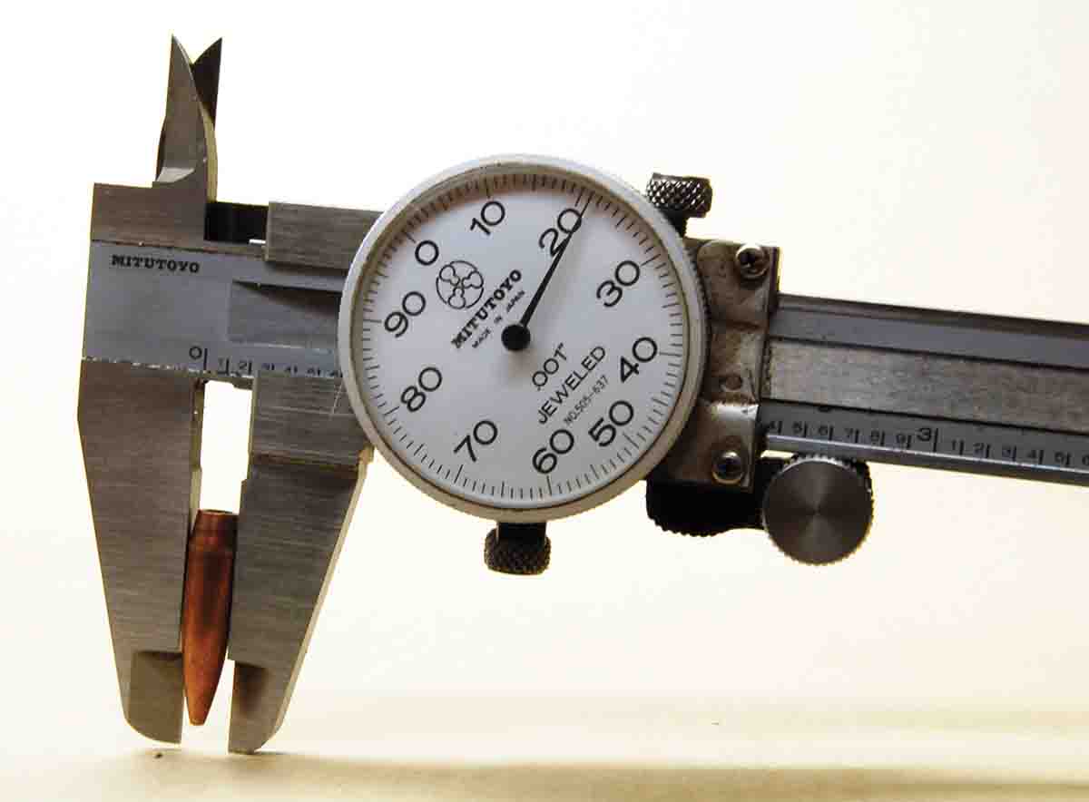 The caliper shows the diameter of the bullet from a 5.45x39mm military round is .221 inch.